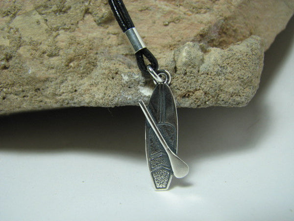 Stand up paddle board pendant on leather cord